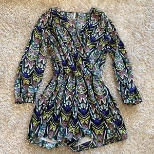 Romper v neck with long loose sleeves.